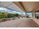 Backyard patio area with brick flooring, covered pergola, and landscaping at 2365 Orangeburg Pl, Henderson, NV 89044