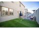 Stylish outdoor space featuring brick pavers, artificial turf, and comfortable seating for relaxation at 2514 Spergola St, Henderson, NV 89044