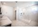 This bathroom features double sinks and a glass shower with tiled walls and floor at 2514 Spergola St, Henderson, NV 89044