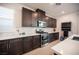 Modern kitchen features stainless steel appliances, gas range, and sleek dark cabinetry at 2514 Spergola St, Henderson, NV 89044