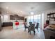 Bright open-concept living and dining area featuring modern lighting and stylish decor at 2514 Spergola St, Henderson, NV 89044