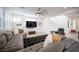 Open-concept living room with neutral tones, sleek furnishings and herringbone floors at 2514 Spergola St, Henderson, NV 89044
