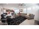 Spacious living room with open floor plan to dining area and modern furnishings at 2514 Spergola St, Henderson, NV 89044