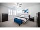 Bright bedroom with large bed, dark dressers, and shuttered windows at 2514 Spergola St, Henderson, NV 89044