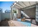 Inviting outdoor patio with brick flooring, pergola, and a cozy fire pit at 2514 Spergola St, Henderson, NV 89044