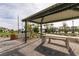 Outdoor community area with covered seating, pavers and desert landscaping at 2598 Mocha Pearl Ct, North Las Vegas, NV 89086