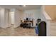 Cozy dining area with wood-look flooring and easy access to the staircase at 2598 Mocha Pearl Ct, North Las Vegas, NV 89086