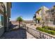 Exterior shot of backyard featuring desert landscaping, green plants, and trees at 2598 Mocha Pearl Ct, North Las Vegas, NV 89086