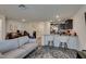 Open-concept living area with bar seating and seamless transition to the kitchen at 2598 Mocha Pearl Ct, North Las Vegas, NV 89086