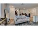 Inviting living room featuring a neutral sofa, full-length mirror, and stylish accents at 2598 Mocha Pearl Ct, North Las Vegas, NV 89086