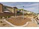 Community playground with elevated rope climbing structure and green space at 2598 Mocha Pearl Ct, North Las Vegas, NV 89086