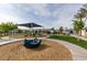 Community playground featuring shade structure, swings, slides, and seesaws at 2598 Mocha Pearl Ct, North Las Vegas, NV 89086