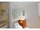 Bathroom featuring a toilet, sink, vanity, large mirror, and glass enclosed shower at 2747 Paradise Rd # 1706, Las Vegas, NV 89109