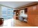 Bedroom boasts a large window, hardwood floors, and built-in shelving and desk at 2747 Paradise Rd # 1706, Las Vegas, NV 89109