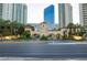 Elegant gated community entrance featuring beautiful landscaping and a clock tower at 2747 Paradise Rd # 1706, Las Vegas, NV 89109