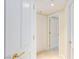 A bright hallway with multiple white doors and gold hardware leads to other rooms at 2747 Paradise Rd # 1706, Las Vegas, NV 89109