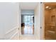 Hallway leading to the bathroom and bedroom with hardwood floors and neutral walls at 2747 Paradise Rd # 1706, Las Vegas, NV 89109