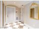 Refined hallway with marble floors, elegant wall coverings, and an ornate mirror, leading to exits and elevator access at 2747 Paradise Rd # 1706, Las Vegas, NV 89109