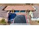 Aerial view of two homes each with a blue garage door and shared in-ground pool at 2773 Chetco River St, Laughlin, NV 89029