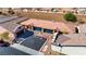 Aerial view of a home with a blue garage door and an in-ground pool in the backyard at 2773 Chetco River St, Laughlin, NV 89029