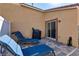 Cozy back patio with brick pavers, lounge chairs, and a grill for outdoor cooking at 2773 Chetco River St, Laughlin, NV 89029