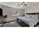 Comfortable bedroom with ceiling fan, large window, and a queen-sized bed at 2773 Chetco River St, Laughlin, NV 89029