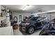 Spacious garage featuring a dark SUV and plenty of room for storage at 2773 Chetco River St, Laughlin, NV 89029
