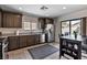 Well-appointed kitchen with stainless steel appliances, dark wood cabinets, and granite countertops at 2773 Chetco River St, Laughlin, NV 89029
