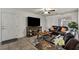Spacious living room featuring tile flooring, a sofa, a large TV, and ample natural light at 2773 Chetco River St, Laughlin, NV 89029