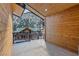 Balcony with wood paneling showcasing mountain views and a neighboring log cabin house at 306 Crestview Dr, Las Vegas, NV 89124