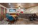 Entertainment space with a custom wood bar, retro appliances, and a game table at 306 Crestview Dr, Las Vegas, NV 89124