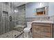 Contemporary bathroom featuring glass shower, vanity, and modern toilet at 306 Crestview Dr, Las Vegas, NV 89124