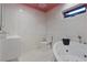Bright bathroom featuring modern vanity, toilet, and jacuzzi tub at 306 Crestview Dr, Las Vegas, NV 89124