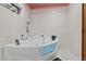 Modern bathroom featuring custom glass tub and tile surround at 306 Crestview Dr, Las Vegas, NV 89124