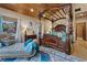 Bedroom showcasing a four poster bed, lounge, and mountain views at 306 Crestview Dr, Las Vegas, NV 89124