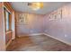 This bedroom boasts ample natural light, hardwood floors, and recessed lighting at 306 Crestview Dr, Las Vegas, NV 89124