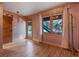 Bedroom with wood-look floors, a door to the deck, and a serene view at 306 Crestview Dr, Las Vegas, NV 89124
