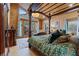 Bedroom boasts mountain views, a four poster bed, and elegant decor at 306 Crestview Dr, Las Vegas, NV 89124