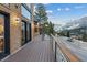 Wood deck overlooking the street, with mountain views, and black metal railings at 306 Crestview Dr, Las Vegas, NV 89124
