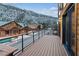 Wood deck featuring mountain views, safety railing, and other properties nearby at 306 Crestview Dr, Las Vegas, NV 89124