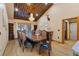 Elegant dining room with wood ceiling, decorative chandelier, and traditional furnishings, ideal for hosting dinner parties at 306 Crestview Dr, Las Vegas, NV 89124