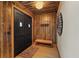 Grand entryway showcasing beautiful wood paneling, double doors, and elegant decor at 306 Crestview Dr, Las Vegas, NV 89124