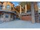 Stunning home exterior showcasing stone accents, wood paneling, and a spacious driveway at 306 Crestview Dr, Las Vegas, NV 89124
