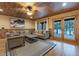 Comfortable living room features wood trim, neutral furnishings, and picturesque views through large windows at 306 Crestview Dr, Las Vegas, NV 89124