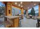 Outdoor kitchen and BBQ area flow into the scenic covered patio with a fire pit at 306 Crestview Dr, Las Vegas, NV 89124