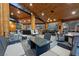 Large covered patio featuring a hot tub, dining area, grill, and comfortable seating at 306 Crestview Dr, Las Vegas, NV 89124
