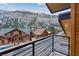 Beautiful mountain views from the balcony of this house with surrounding log cabin houses at 306 Crestview Dr, Las Vegas, NV 89124