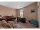Cozy living room featuring neutral walls and carpet, with a large window at 33 Via Di Mello, Henderson, NV 89011