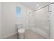 This bathroom boasts tiled floors, a toilet, and glass-enclosed shower at 3541 Arcadian Sea St, Las Vegas, NV 89106