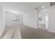 Bright bedroom with neutral carpet, a large window, and an open layout at 3541 Arcadian Sea St, Las Vegas, NV 89106